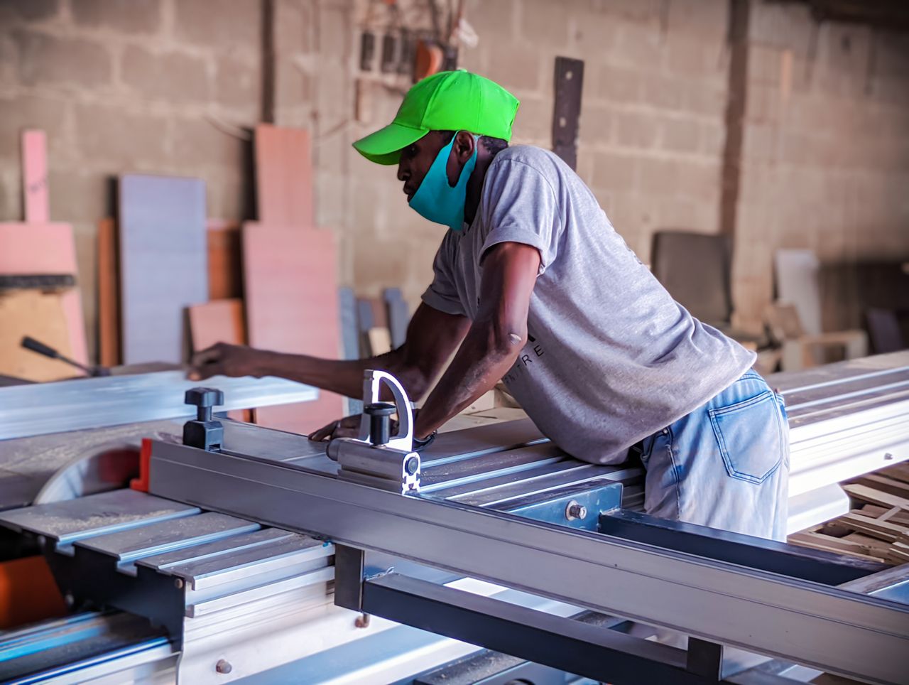 The Art of Drawing Readers In: Your attractive post title goes here A skilled African woodworker focused on operating machinery in a workshop in Kaduna, Nigeria.
